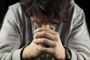 bowed in prayer